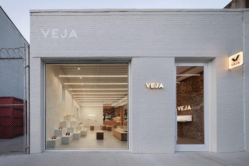 Veja Brooklyn storefront with white brickwork and large window looking inside